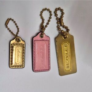 Coach set of three hang tags gold metal pink and gold patent